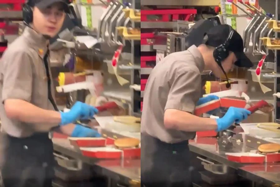 Seorang pekerja bertindak meludah pada hidangan burger sebelum diserahkan kepada pelanggan.