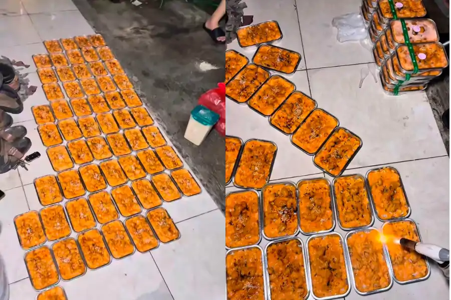 Ramai netizen menegur wanita tersebut kerana dilihat meletakkan makanan di atas lantai.