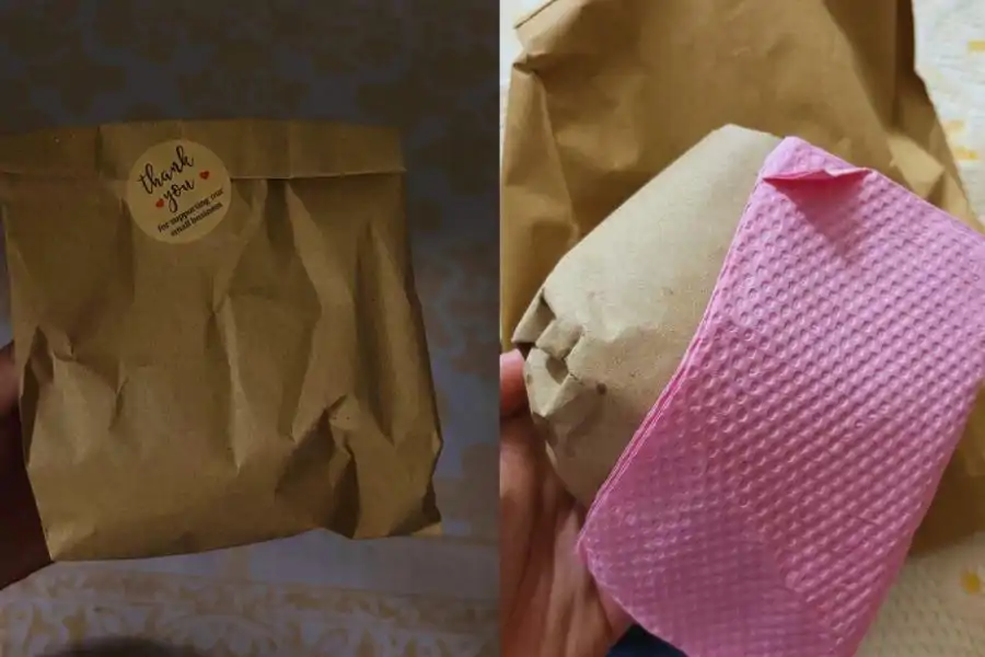Wanita ini turut menunjukkan burger yang diterima, lengkap dengan pembungkusan comel hasil sentuhan kreatif peniaga.